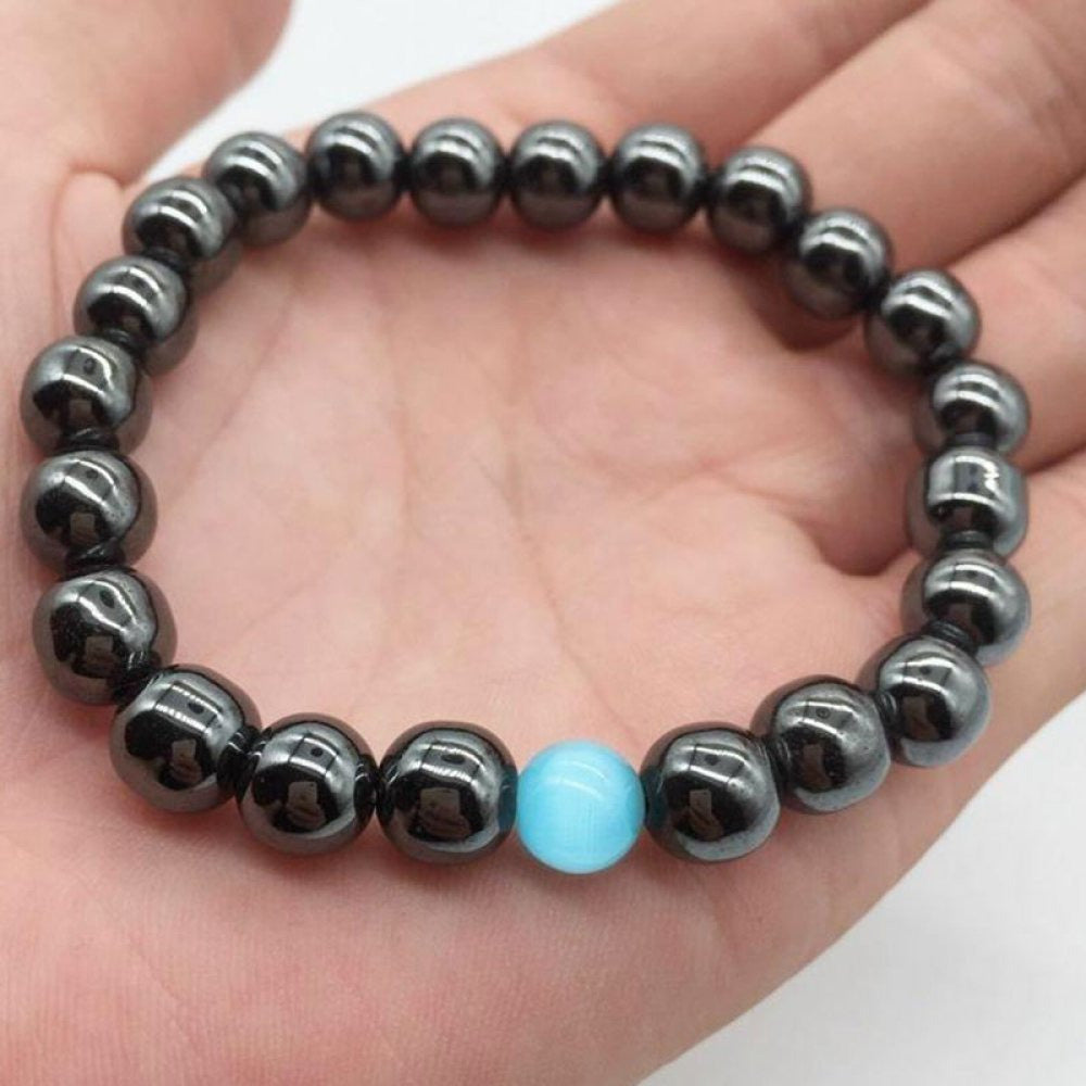 Hæmatit slankende armbånd med blå opalperle